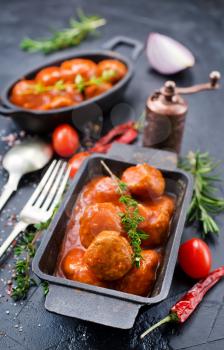 meatballs with tomato sauce in metal bowl
