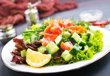 fresh salad with salmon, salad on plate