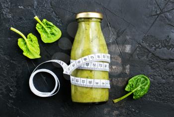 smoothie with spinach and kiwi in bottle