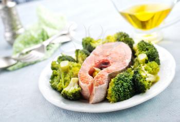 salmon steak with broccoli and spice on plate