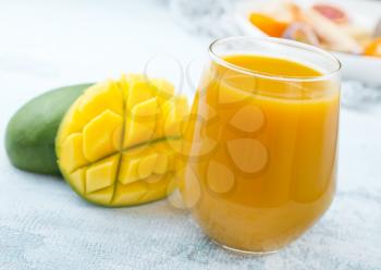 mango juice in glass, fresh juice and fruits