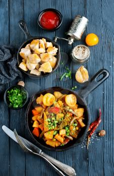 vegetable stew in pan, fried vegetables with oil and spice