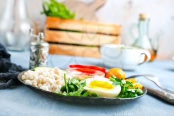  Bulgur porridge egg and fresh vegetables. Diet menu. Diet food