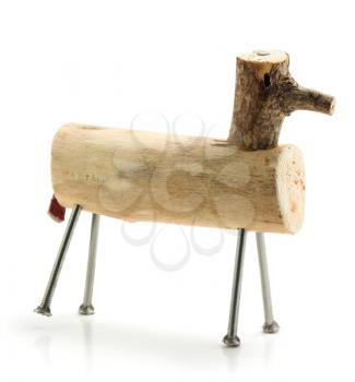 Handmade wooden horse toy with nails as legs isolated on white background