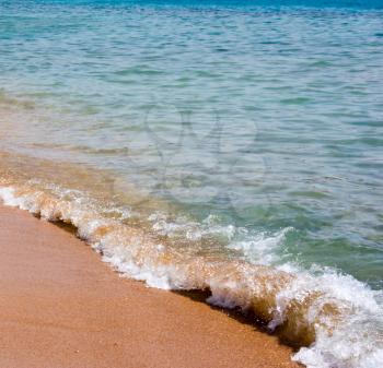 Sea waves on the sand beach, natural background, minimalistic landscape