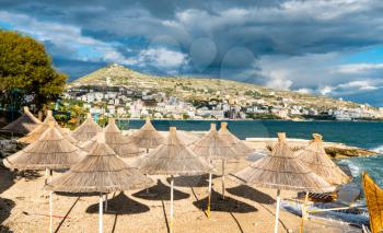 Straw umbrellas on a beach in Sarande, South Albania