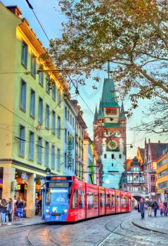 Freiburg im Breisgau, Germany - October 14, 2017: Siemens Combino tram in the old town. The Freiburg tram network consists of 5 lines with 73 stops.