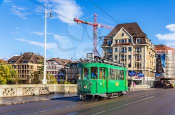 BASEL, SWITZERLAND - NOVEMBER 03: Heritage tram Ce 2/2 on Middle Bridge on November 03, 2013 in Basel , Switzerland. Basel tram network consists of 12 lines