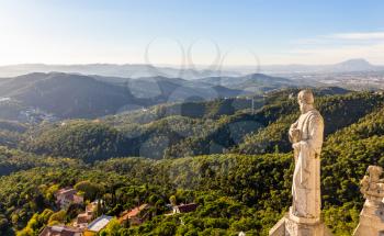 Sculpture of Apostle and mountains near Barcelona