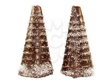 Two chocolate cone in the form a snowy trees isolated on a white background
