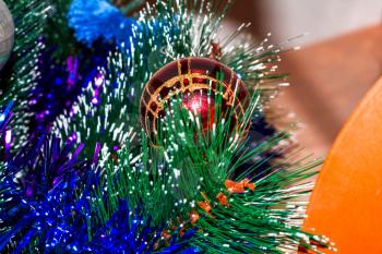 Colorful christmas background with colored balls on an artificial Christmas tree