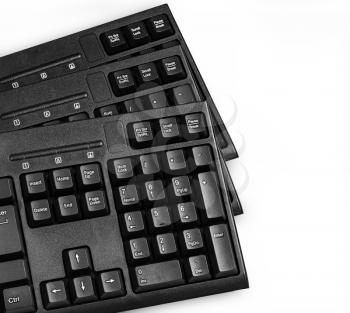 Three computer keyboards isolated on white background