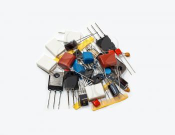 A handful of electronic components isolated on white background