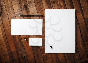 Corporate identity template on wooden table background. Blank stationery set. Mock-up for branding identity for designers. Top view.