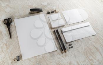 Photo of blank stationery. Blank corporate identity template on light wooden background. For design presentations and portfolios.