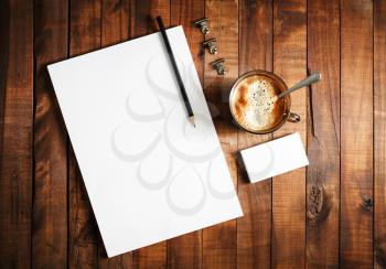 Blank branding template. Photo of blank stationery set on vintage wooden table background. Letterhead, cup of coffee, business cards and pencil. Blank branding template. Corporate identity mock-up. To