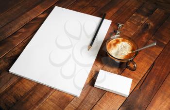 Blank paperwork template on vintage wooden table background. Responsive design mockup. Mock-up for your design.