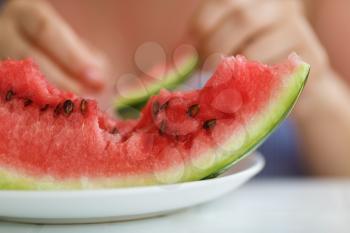 A piece of delicious juicy watermelon. Shallow depth of field.