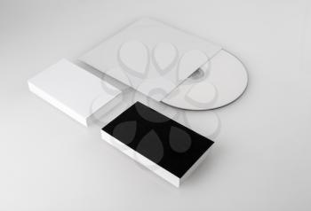 Blank business cards and compact disc. Template for corporate identity for designers. Shallow depth of field.