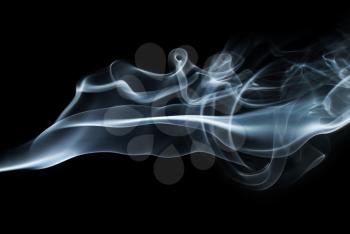 Photo of Smoke swirls on black background. Abstract smoke. Studio shot.