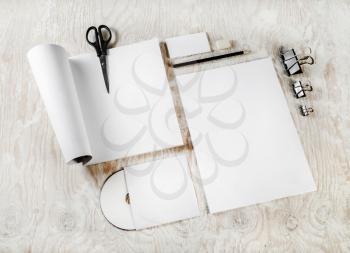 Photo of blank stationery set. Blank corporate identity template on light wooden background. Mock-up for your design.