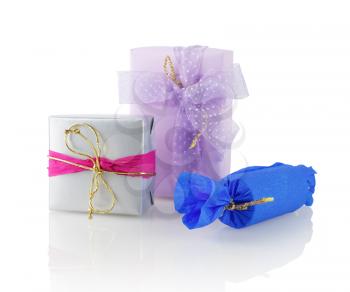 Gift boxes on a white background with reflection. Isolated with clipping path. Shallow depth of field.