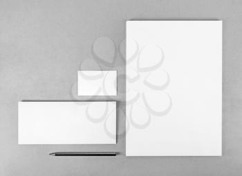 Photo of blank stationery set. Blank stationery template for branding identity for designers. Top view. Grayscale image.