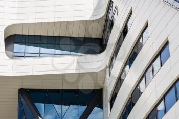 Abstract modern architecture. Close-up fragment of modern office building of steel and glass. Steel and glass modern architecture. Close-up of modern architecture.