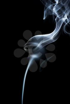 Photo of abstract light smoke on a black background. Vertical shot.