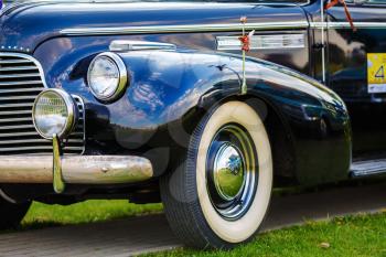 MINSK, BELARUS - MAY 07, 2016: Close-up photo of black Buick Eight 1940 model year. Old retro classic car. Selective focus.