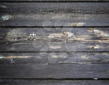 Weathered wood boards with knots. Natural dark wooden background.