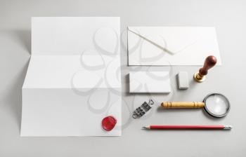 Photo of blank stationery set on paper background. Mock up for branding identity. ID template. Responsive design mockup. Top view.