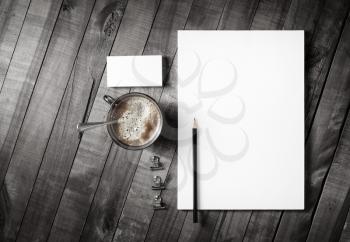 Blank corporate stationery template on vintage wooden table background. Branding mock-up. Top view.