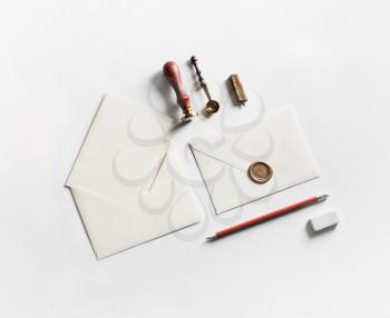 Blank stationery for creativity with envelopes on white paper background.