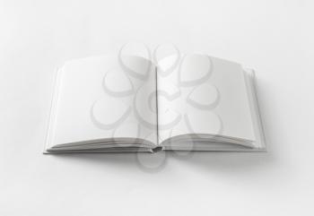 Blank book on white paper background.