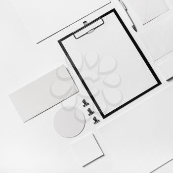 Blank stationery template on white paper background. Top view. Flat lay.