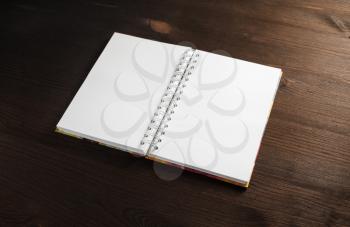 Blank notepad mock up on wooden background.