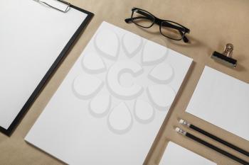 Photo of blank stationery set on craft paper background. Corporate identity mock up for placing your design.