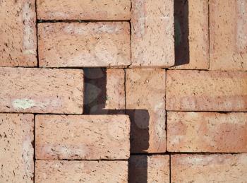 Brick stack background. Red clay bricks. Flat lay