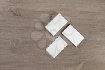 Blank business cards mockup on wood table background. Flat lay.
