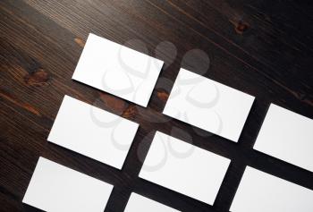 Photo of blank white business cards mock-up on wooden background. Branding mock up. Flat lay.