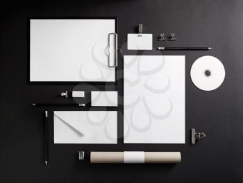 Blank branding template. Corporate stationery on black paper background. Top view.
