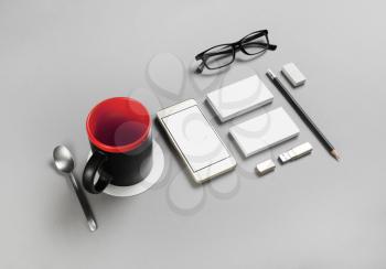 Blank corporate stationery and gadgets on gray paper background. Brand ID elements for placing your design.