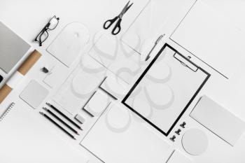 Photo of blank stationery set on white paper background. Corporate identity mock up for placing your design. Flat lay.