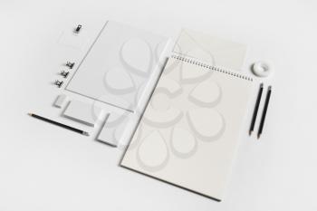 Photo of blank stationery elements on white paper background. Branding template. Mock-up for your design.