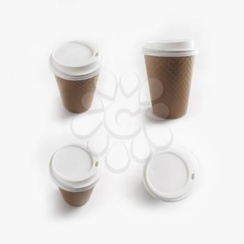 Disposable paper coffee cups. Package for drinks.