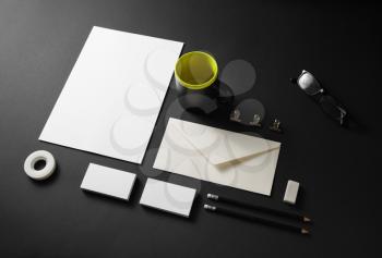 Blank stationery set on black paper background. Corporate identity template. Responsive design mockup.