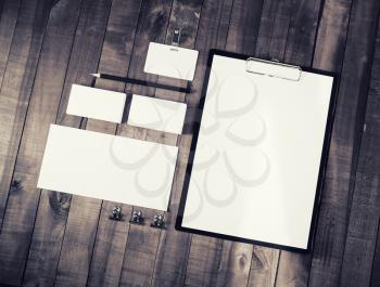 Photo of blank stationery set on vintage wood background. ID template. Mock up for branding identity. Top view.