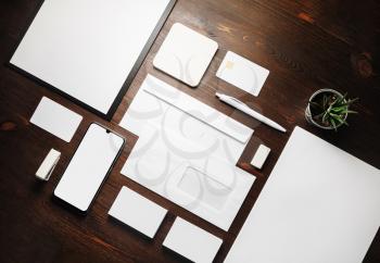 Stationery mock up. Blank corporate identity template on wood table background. Responsive design mockup. Flat lay.