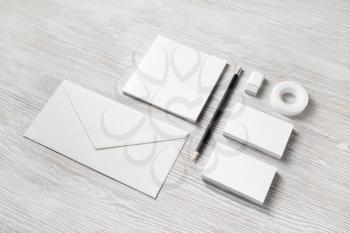 Branding mock up. Photo of blank corporate stationery on light wood table background.